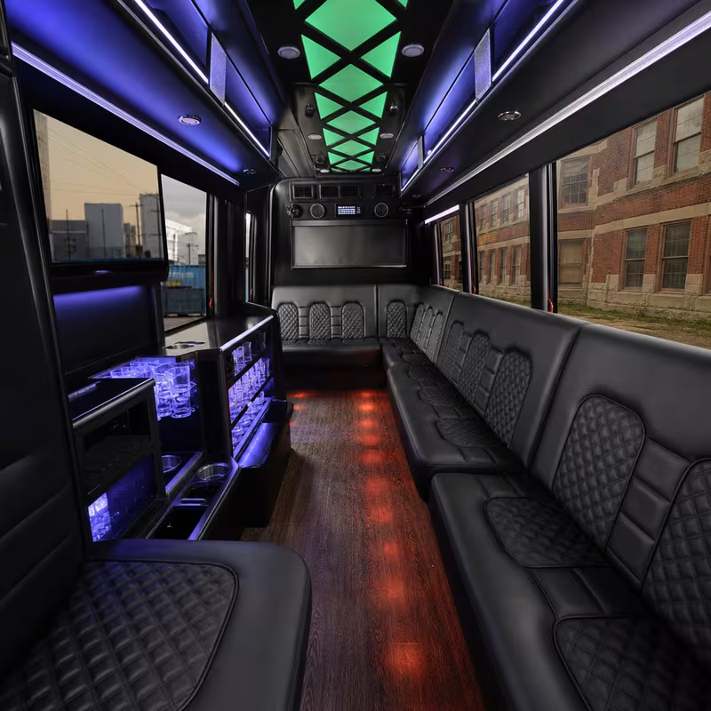 Party bus interior with wraparound leather seating and LED lighting in Newark