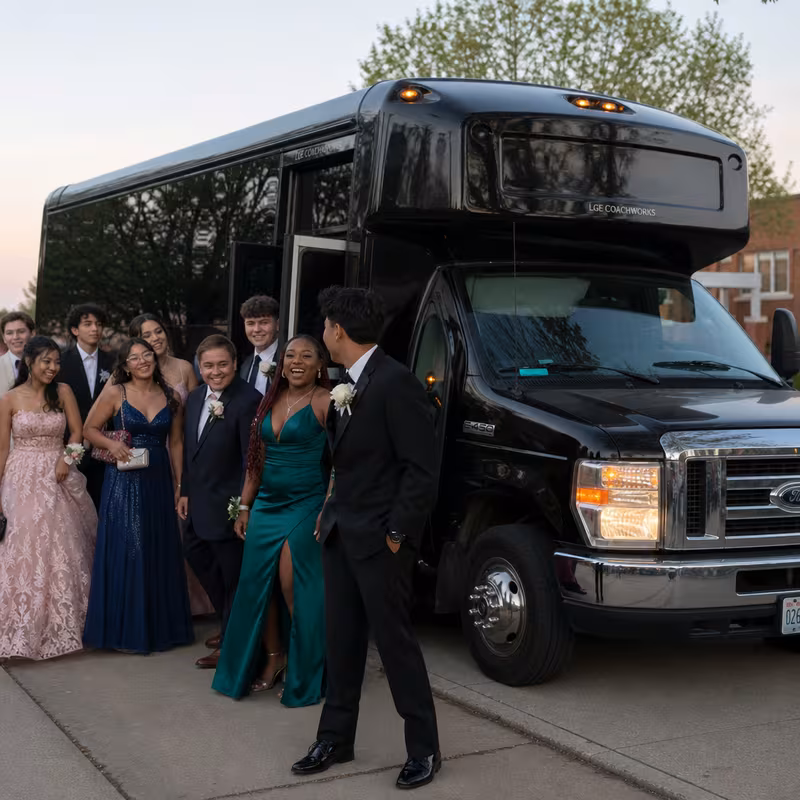 Group boarding a white charter bus for Prom & Homecoming Transportation transportation in Newark