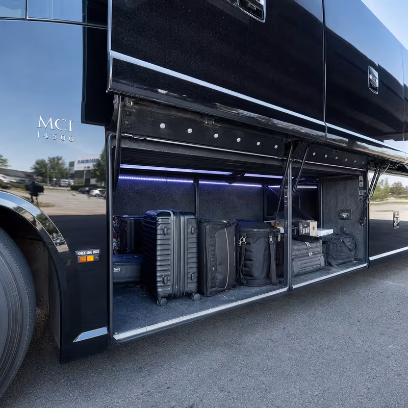 Party bus interior with wraparound leather seating and LED lighting in Newark