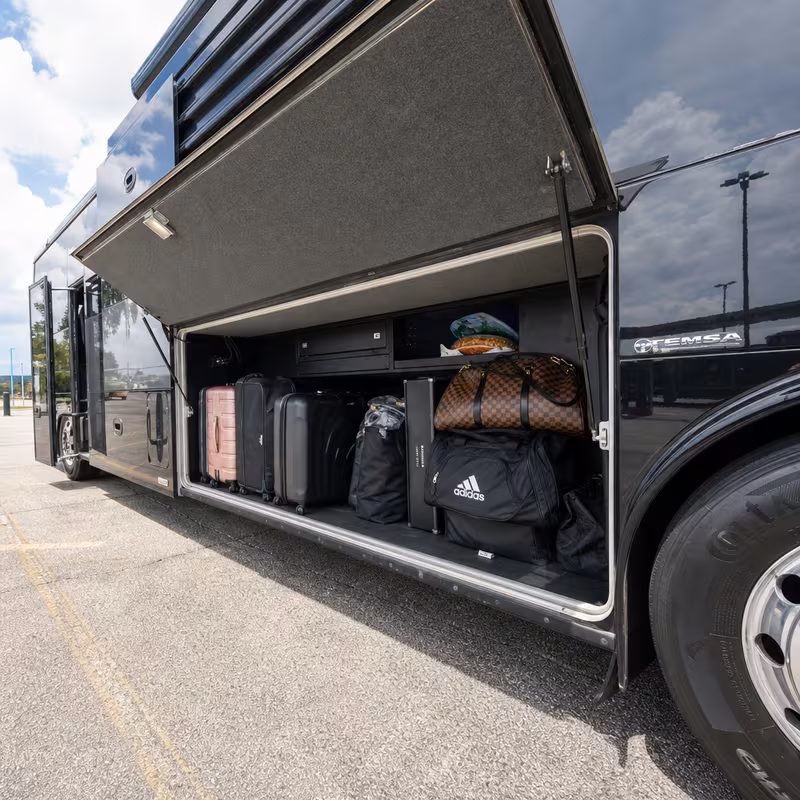 Party bus interior with wraparound leather seating and LED lighting in Newark