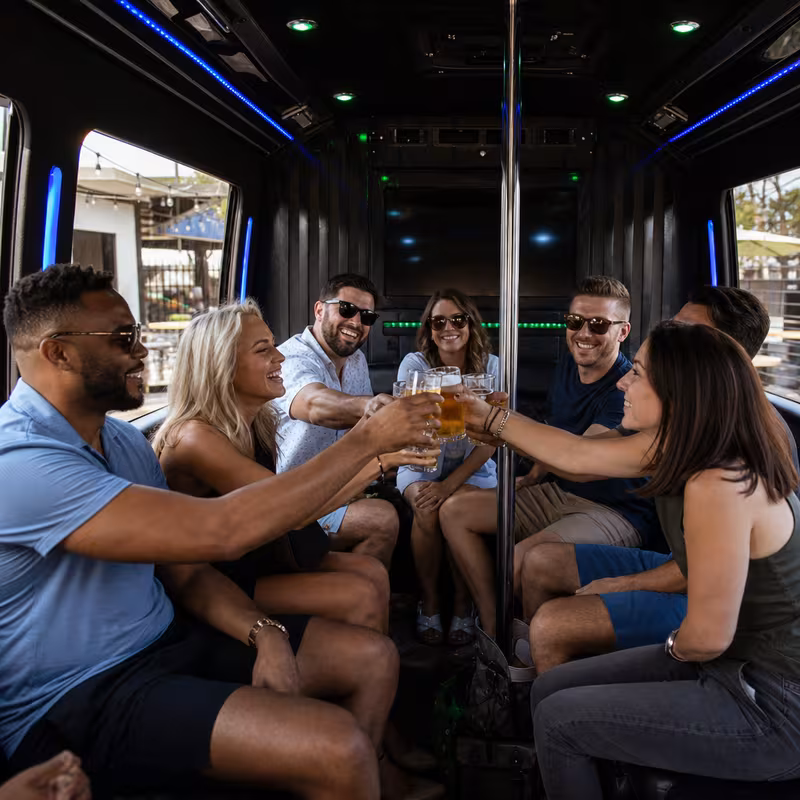 Group boarding a white charter bus for Winery & Brewery Tour Transportation transportation in Newark