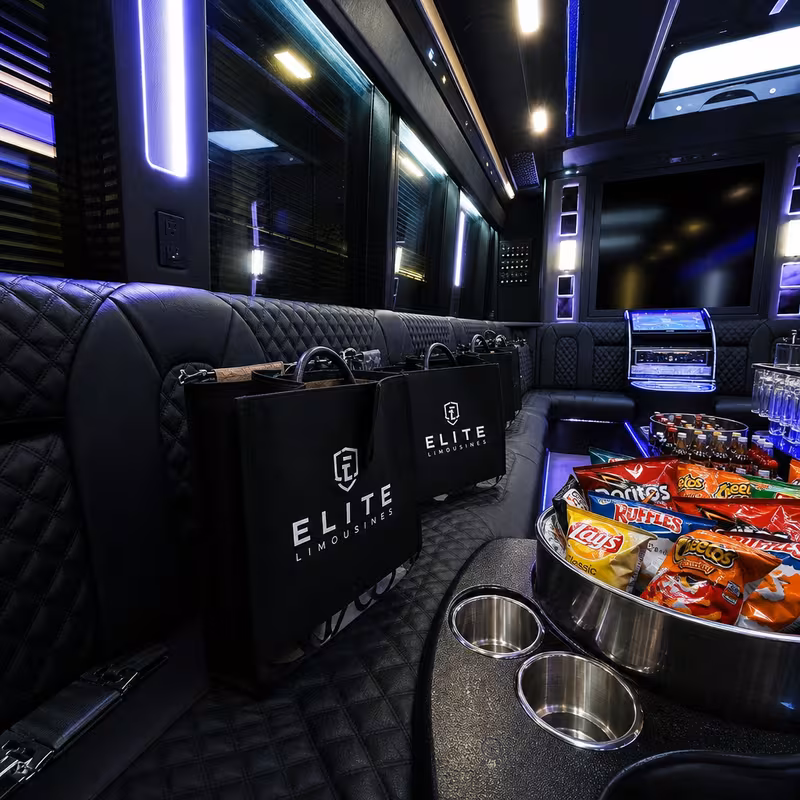Party bus interior with wraparound leather seating and LED lighting in Newark
